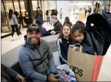  ?? DAI SUGANO — BAY AREA NEWS GROUP ?? Black Friday shopper Alex Michel, his daughters, Natalia, 11, center, and Camila, 8, talk about the shopping experience on Black Friday at Westfield Valley Fair mall.