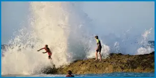  ??  ?? Young swimmers in the swell at Snapper Rocks generated by Tropical Cyclone Oma. Picture: Mark Furler