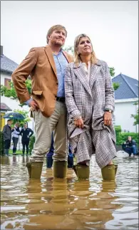  ??  ?? Holland’s King Willem-alexander and Queen Maxima visit Valkenburg in the wake of this week’s devastatin­g floods