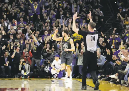  ?? Photos by Carlos Avila Gonzalez / The Chronicle ?? Klay Thompson gestures after hitting a 3-pointer in the second half, when he scored 20 of his 29 points against the Heat.
