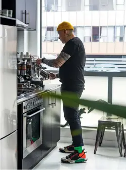  ??  ?? THIS PAGE (from top) Martin painted the kitchen cabinets Resene All Black; the runner is from Collected in Auckland. Martin starts each day with a coffee using his E61 Rocket Espresso machine from L’affare.