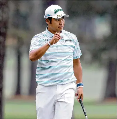  ?? CURTIS COMPTON/CURTIS.COMPTON@AJC.COM ?? Hideki Matsuyama makes an eagle on the 15th hole during Saturday’s third round, giving him a one-shot lead as he pulled away from the field after a 78-minute weather delay. He takes a four-stroke lead into the final round.