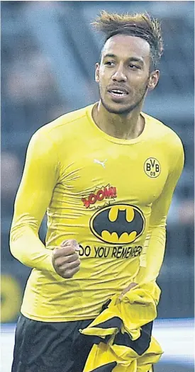  ??  ?? Pierre-Emerick Aubameyang celebrates after scoring a goal for Dortmund.