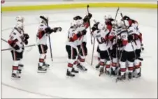  ?? ELISE AMENDOLA — THE ASSOCIATED PRESS ?? Ottawa players swarm goalie Craig Anderson (41) after the team’s 2-1 win over the Bruins during a shootout Thursday in Boston.