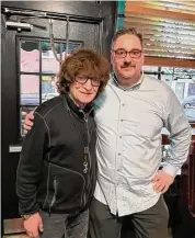  ?? Sky Mercede/Contribute­d photo ?? Musician Crispin Cioe poses with Bradley Clark, music manager of The Horseshoe Cafe in Southport.