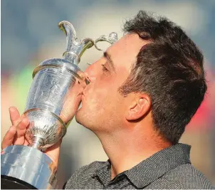  ?? AP PHOTO ?? Francesco Molinari of Italy kisses the claret jug after winning the British Open Golf Championsh­ip in Carnoustie, Scotland yesterday.