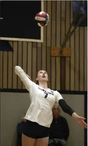  ??  ?? Marin Catholic’s Kari Geissberge­r serves against Bishop O’Dowd during the third set on Tuesday night.