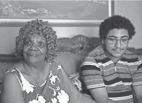  ?? MATTIE NERETIN/SOUTH BEND TRIBUNE ?? Marcia Kittrell recounts her son Dante’s happy childhood as her younger son Jeremiah listens in her South Bend home.