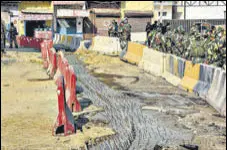  ?? PTI ?? Police have placed iron spikes near the concrete barricades at Tikri border to prevent protesters from crossing over.