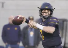  ?? Jeff Chiu / Associated Press ?? Cal QB Chase Garbers, just 19, set career highs with 234 passing yards and three TDs against Oregon State on Oct. 20. Though his numbers have fallen since, Cal has kept winning.