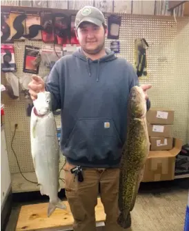  ??  ?? Ken Maggiore holds his Illinois- record whitefish ( left) and burbot. Both were caught Wednesday at Montrose Harbor.
| COURTESY OF HENRY’S SPORTS AND BAIT SHOP