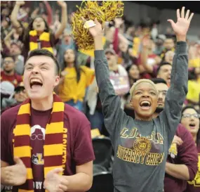  ??  ?? Fans cheer the Ramblers during the Gentile Arena watch party. Loyola led by 10 in the second half but stumbled down the stretch.