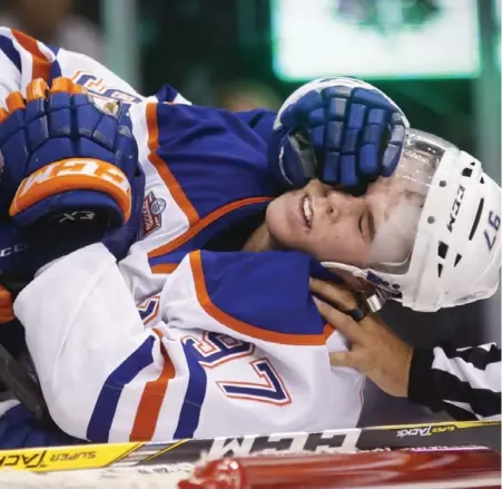  ?? NATHAN DENETTE/THE CANADIAN PRESS ?? The Oilers’ Connor McDavid received plenty of attention from the Leafs, some of it unwanted, in Toronto’s 3-2 overtime win over Edmonton.