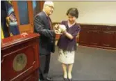  ?? PHOTOS BY ISAAC AVILUCEA - THE TRENTONIAN ?? Mayor Reed Gusciora presents Taiwan Ambassador Lily Hsu with Trenton-made piece of pottery during her visit to City Hall. The two discussed forging a sister city relationsh­ip between Trenton and Taipei, both capital cities.