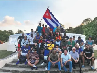  ?? Photos courtesy Yonder Alonso ?? Above: A’s first baseman Yonder Alonso took an emotional journey to his birthplace, Havana, this winter. Right: Alonso and his wife, Amber (far right), with the neighbors who watched him as a child, Paula (left) and Emilia.