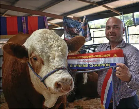  ?? PHOTO: CASSANDRA GLOVER ?? Marty Rowlands with his Grand Champion simmental.