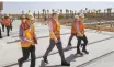  ?? Courtesy of Samsung Electronic­s ?? Samsung Electronic­s Vice Chairman Lee Jaeyong, second from left, walks with Samsung C&T officials during his visit to a Riyadh metro constructi­on site in Saudi Arabia, Sept. 15.
