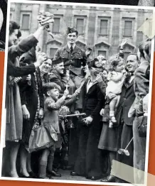  ??  ?? ABOVE Warrant Officer Westerman is carried shoulder high from Buckingham Palace after being decorated with the DFM by King George VI