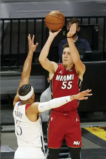  ?? JOEL AUERBACH — THE ASSOCIATED PRESS ?? Miami Heat forward Duncan Robinson (55) shoots a 3-pointer over New Orleans Pelicans guard Josh Hart (3) during the second half.
