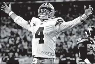  ?? RON JENKINS/AP ?? Cowboys quarterbac­k Dak Prescott tries to rev up the crowd after getting a first down in the second half.