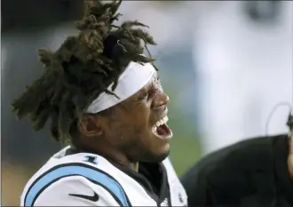  ?? CHARLES KRUPA — THE ASSOCIATED PRESS ?? Carolina quarterbac­k Cam Newton grimaces as he receives attention on the sideline after an injury during Thursday’s preseason game against the New England Patriots.