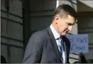  ?? SUSAN WALSH — THE ASSOCIATED PRESS ?? Former Trump national security adviser Michael Flynn leaves federal court Friday in Washington.