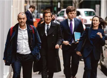  ?? Jordan Pettitt/Associated Press ?? Attorney David Sherborne, second from left, at the Rolls Buildings, central London, Wednesday. Prince Harry alleged Thursday, that the publisher of The Sun tabloid unlawfully intercepte­d phone calls of his late mother, Princess Diana, and father, now King Charles III, as he sought to expand his privacy invasion lawsuit against News Group Newspapers.