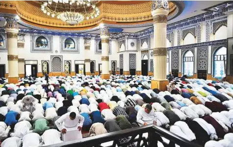  ?? Clint Egbert/Gulf News ?? People start their day with the morning Eid Al Fitr prayer at Al Farooq Omar Bin Al Khattab Mosque in Dubai yesterday