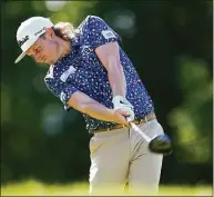  ?? Darron Cummings / Associated Press ?? Cameron Smith tees off on the 18th hole during the second round of the Memorial on Friday in Dublin, Ohio.