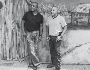  ?? Joe Holley / Staff ?? Cousins Victor Morrison and Anthony “Dondo” Upshaw, standing before a mural created at Uncle Doug’s by another cousin, are hoping to attract customers from beyond Lufkin and Nacodoches.