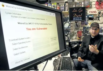  ?? CLIFFORD SKARSTEDT/EXAMINER FILE PHOTO ?? Owner David Wilson of Let's Get Digital talks about the WannaCry Ransomware virus on May 16 in Peterborou­gh. Wilson wrote a small program that the public can download and run to check whether or not they're vulnerable to the WannaCry Ransomware virus that was attacking computer systems around the world in the first half of 2017. It was one of the biggest stories in tech news over the year.