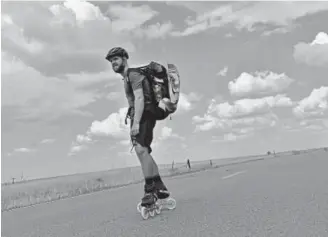  ?? Photos by Hyoung Chang, The Denver Post ?? Mike Lempko, shown near Denver on July 12, is in-line skating from San Francisco to Brooklyn, N.Y., and raising money for No Kid Hungry, a national campaign, along the way.