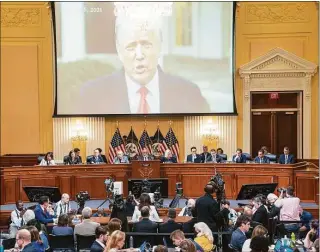  ?? Sean Thew / Associated Press ?? A video of former President Donald Trump from his Jan. 6, 2021, Rose Garden statement is played as Cassidy Hutchinson, former aide to Trump White House chief of staff Mark Meadows, testifies at the House select committee hearing at the Capitol in Washington on Tuesday.