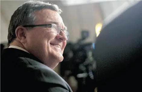  ?? JUSTIN TANG/THE CANADIAN PRESS ?? Finance Minister Jim Flaherty speaks during a TV interview after tabling the budget on Parliament Hill in Ottawa Tuesday.