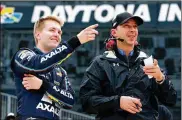  ?? SEAN GARDNER / GETTY IMAGES ?? William Byron, driver of the #24 Axalta Chevrolet, talks with crew chief Chad Knaus during qualifying for the Daytona 500 on Sunday in Daytona Beach, Florida.