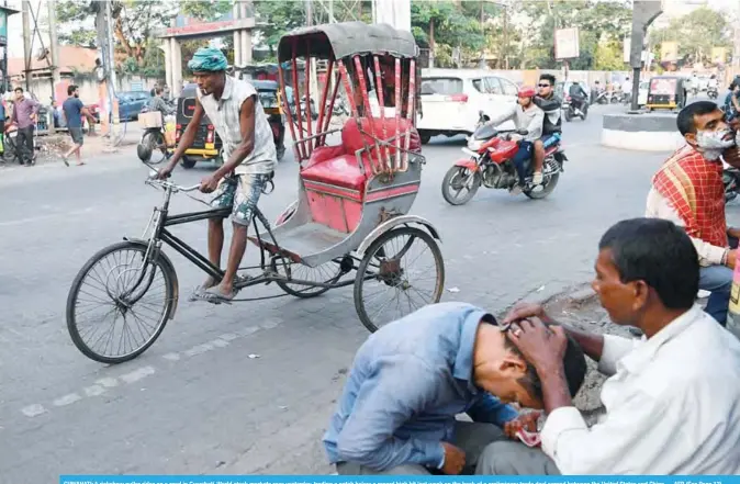  ??  ?? GUWAHATI: A rickshaw puller rides on a road in Guwahati. World stock markets rose yesterday, trading a notch below a record high hit last week on the back of a preliminar­y trade deal agreed between the United States and China. —AFP (See Page 13)