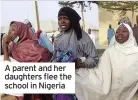  ??  ?? A parent and her daughters flee the school in Nigeria