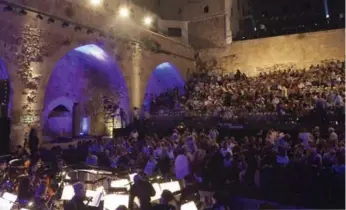  ?? RINA CASTELNUOV­O FOR THE NEW YORK TIMES ?? Last year’s Israeli Opera Festival staged Don Giovanni inside the walls of the city’s Crusader Courtyard in Acre.