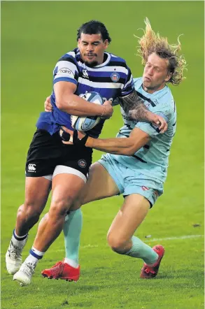  ?? PICTURE: Stu Forster/getty Images ?? Josh Matavesi is tackled by Billy Twelvetree­s