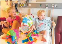  ??  ?? Luke Drummond, right, with his sister Briar after having open heart surgery last December at the age of 2.