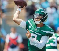  ?? Nell Redmond / Associated Press ?? New York Jets quarterbac­k Zach Wilson throws a pass against the Carolina Panthers in the first half last Sunday.