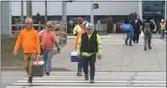  ?? DAVE ANGELL — FOR MEDIANEWS GROUP ?? Hourly workers leave the Warren Truck Assembly Plant Wednesday afternoon after being sent home by FCA.