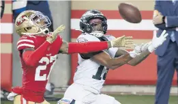  ?? DAVID MAIALETTI/TNS ?? Philadelph­ia’s Travis Fulgham catches a pass for a touchdown as San Francisco 49ers cornerback Dontae Johnson defends in the fourth quarter Sunday night.