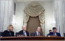  ?? MATT MCCLAIN — THE WASHINGTON POST VIA AP ?? Members of Senate Commerce committee panel — from left, Sen. Cynthia Lummis, R-Wyo., Sen Rick Scott, R-Fla., Sen. Dan Sullivan, R-Alaska, and Sen. Ted Cruz, R-Texas — listen as former Facebook data scientist Frances Haugen testifies at a hearing Tuesday on Capitol Hill.