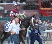  ??  ?? Jockey Luis Saez aboard A Thread of Blue near the winner’s circle at Saratoga Race Course Sunday after winning the first-ever running of The Saratoga Derby Invitation­al.