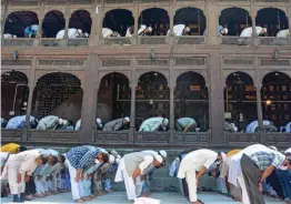  ?? — PTI ?? People offer prayers at famous Shah Hamdan Khanqah-e-Moula shrine during its annual urs in Srinagar on Saturday. Shah Hamdan urs was observed after a gap of two years due to Covid-19 pandemic.