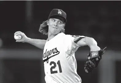  ?? Associated Press ?? Los Angeles Dodgers starting pitcher Zack Greinke throws a pitch during the first inning against the Pittsburgh Pirates on Sept. 18 in Los Angeles. A person with knowledge of the deal tells The Associated Press that free agent Greinke and the Arizona...