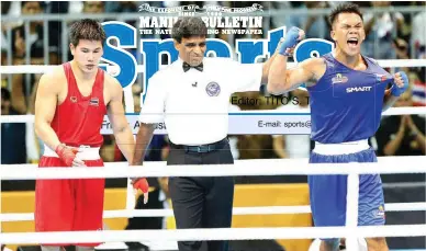  ??  ?? Eumir Felix Marcial of the Philippine­s, right, celebrates after beating Pathomsak Kuttiya of Thailand and winning the gold medal in the men's middleweig­ht final of the boxing competitio­n in the 29th Southeast Asian Games in Kuala Lumpur, Malaysia....