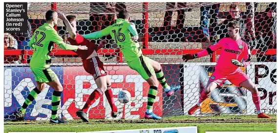  ??  ?? Opener: Stanley’s Callum Johnson (in red) scores