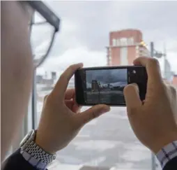  ?? J.P. MOCZULSKI FOR THE TORONTO STAR ?? Hanley Koo says he loves that his new home at Canary District Condos feels like a self-contained city within a city, but is also within walking distance of downtown.